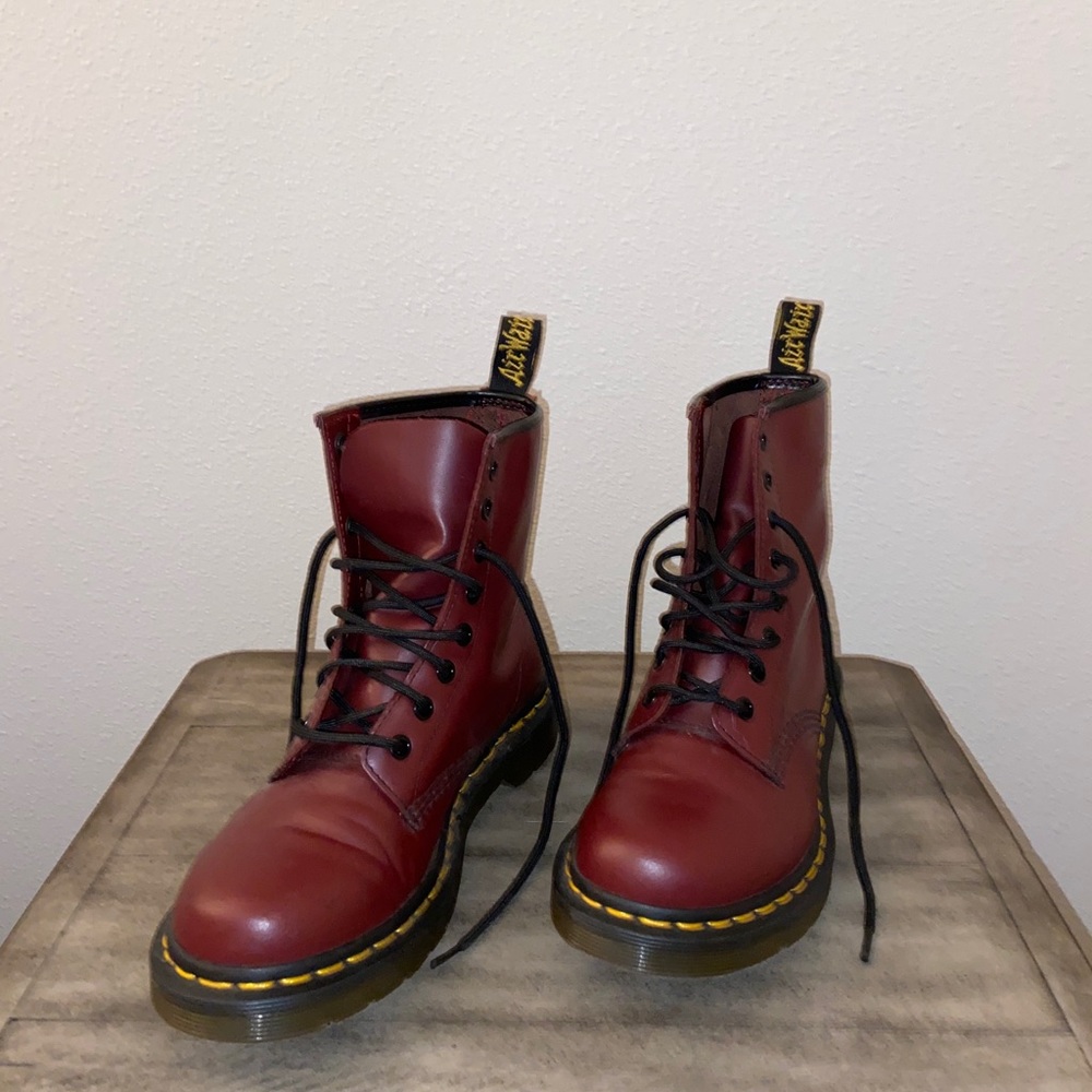 Doctor Martens red lace up boots.